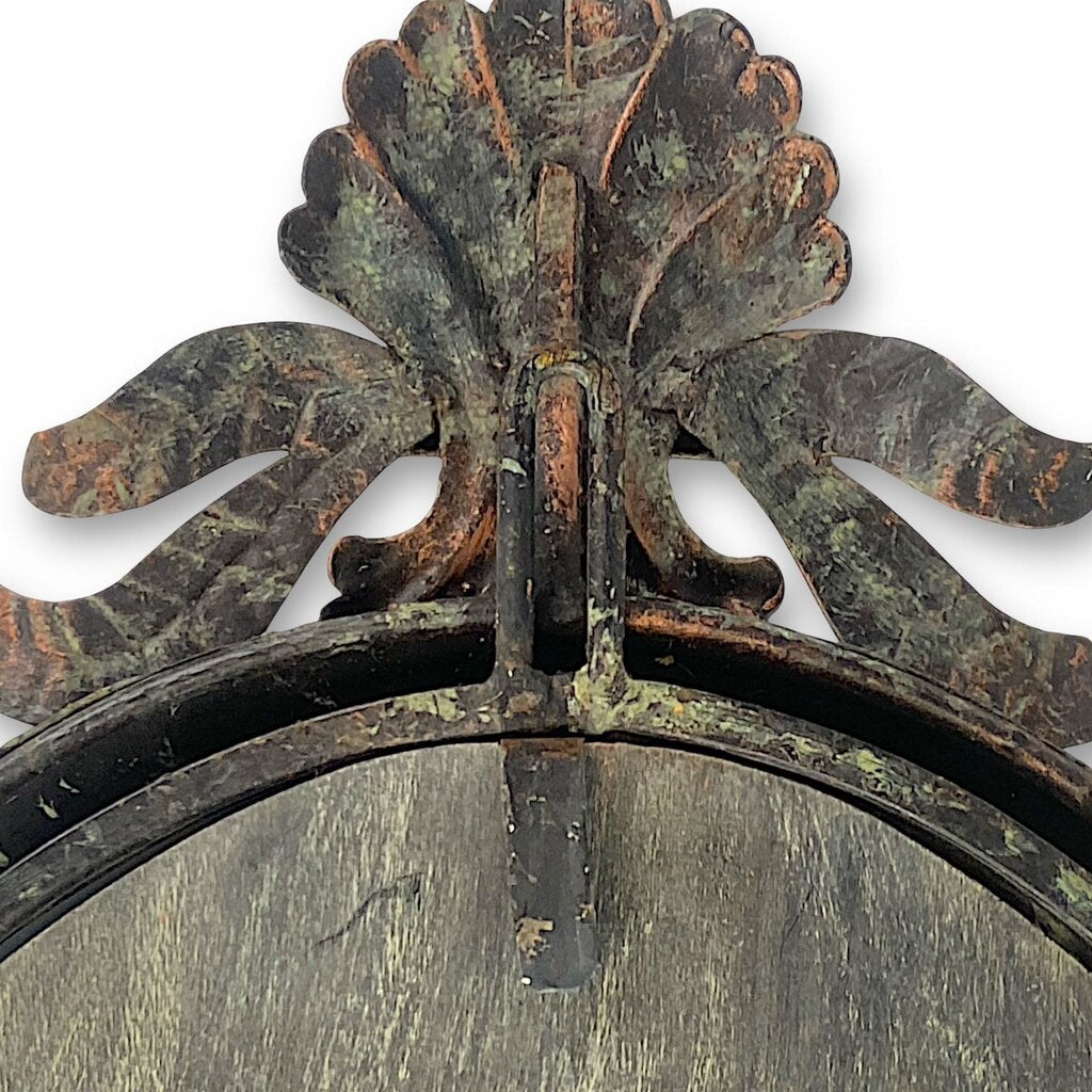 Mirror Framed in Metal with Leafy Detailing