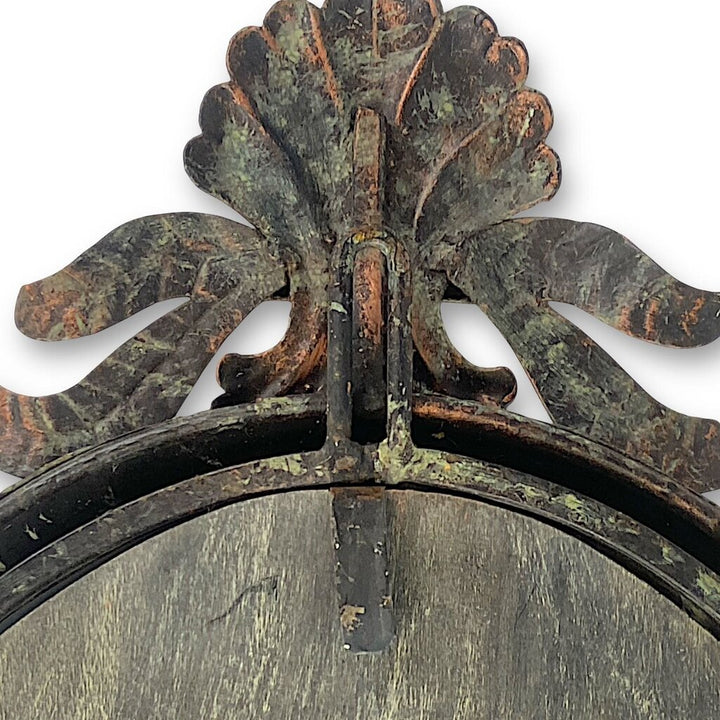 Mirror Framed in Metal with Leafy Detailing