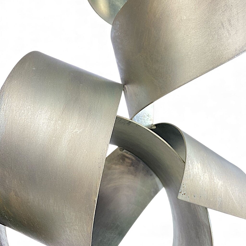 Metal Ribbon Sculpture on Marble