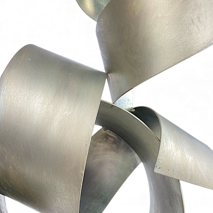 Metal Ribbon Sculpture on Marble