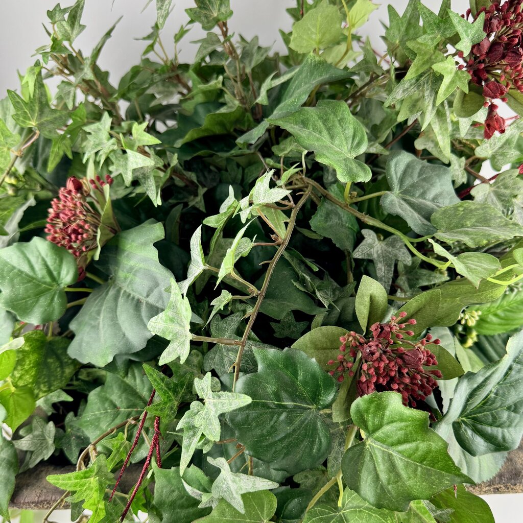 Floral Plant in Footed Planter